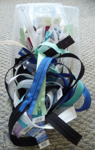 Assorted zippers in a box (Sewn By Tanya Small Business Tip - year end inventory)