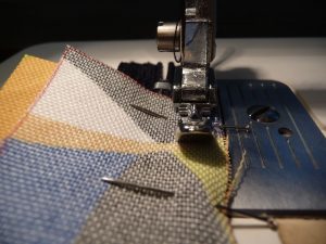 Close up of sewing with narrow zipper foot