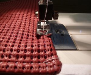 Close up of sewing red subber drawer liner