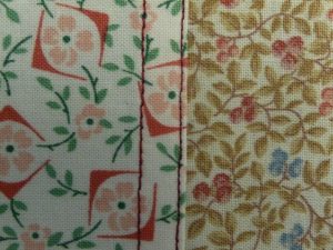 Front view of a flat felled seam joining 2 floral fabrics