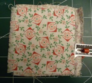 Overlapping floral fabrics on a green background