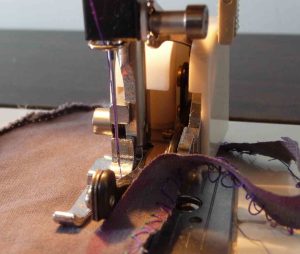 side cutter presser foot trimming fabric on the right side while sewing
