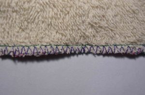 Back view of second pass with side cutter foot; edge of towel is wavey